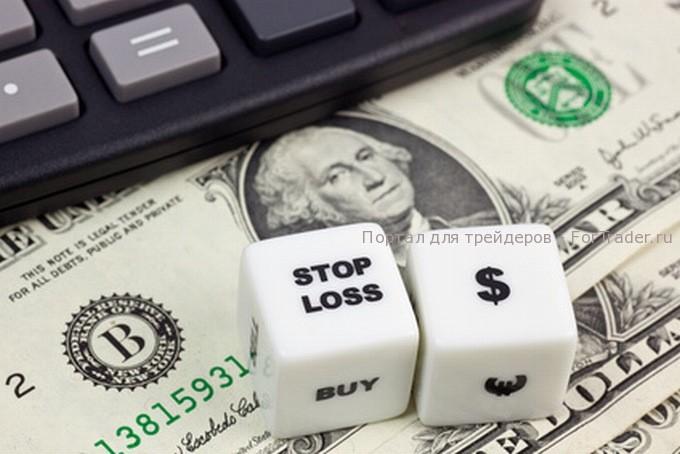 US currency with calculator and dice showing STOP LOSS Стоп-лосс форекс